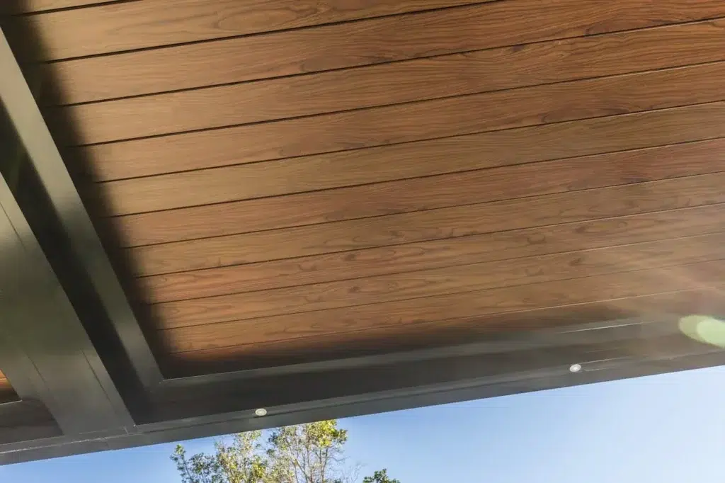 Close up of woodgrain aluminium louvres on Eclipse Opening Roof system.