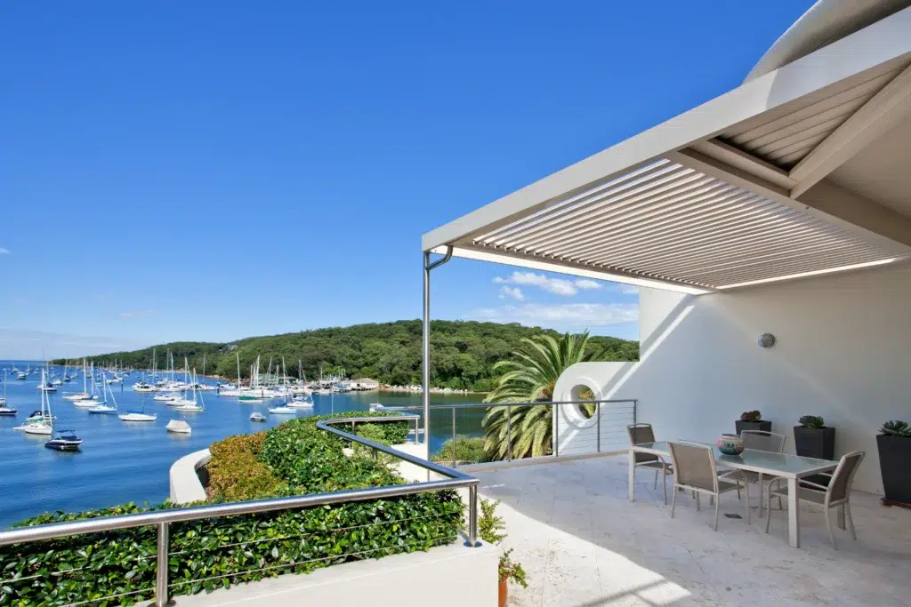 Fairlight opening roof installation view overlooking water.