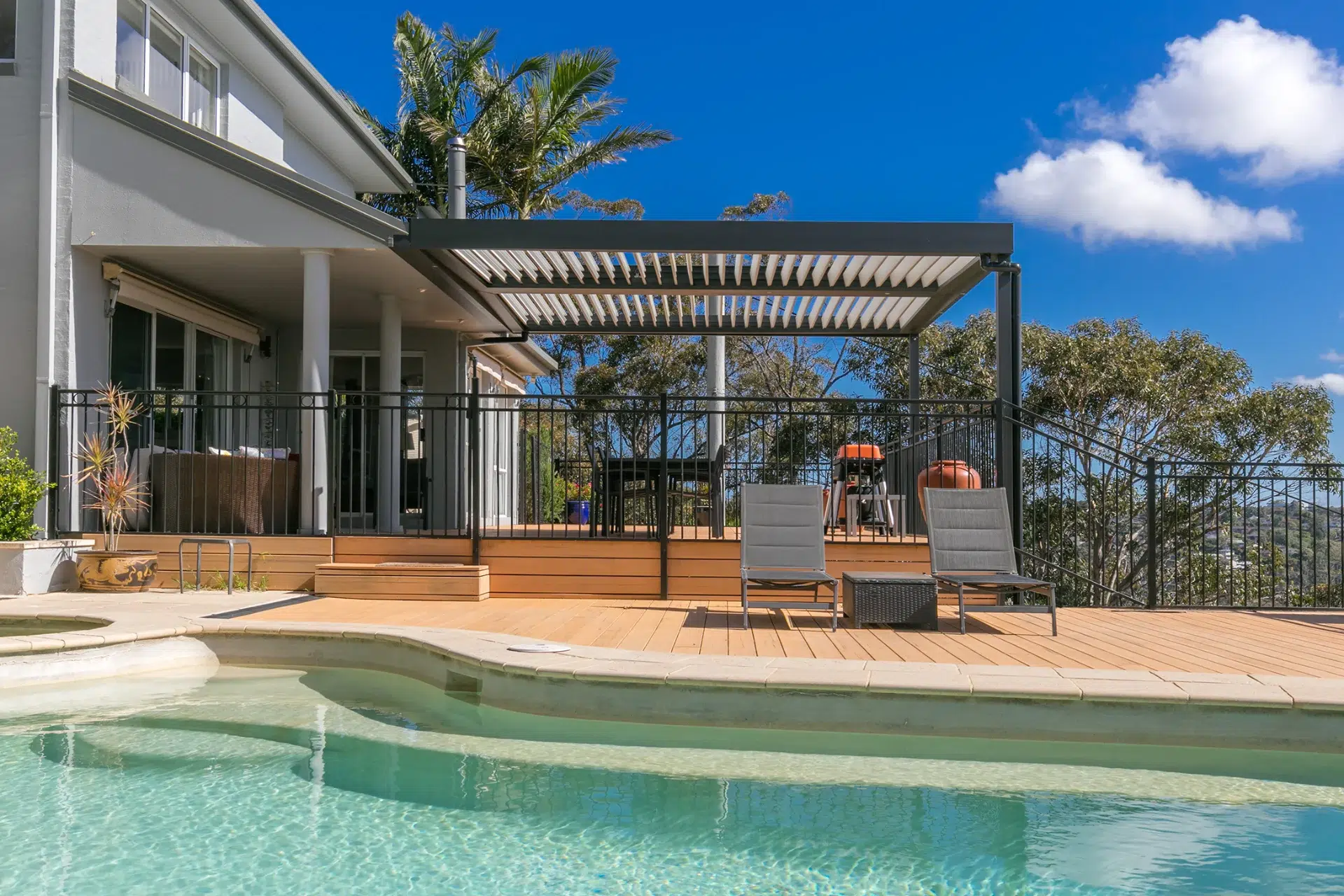 Beacon Hill opening roof system with aluminium louvres view from pool.