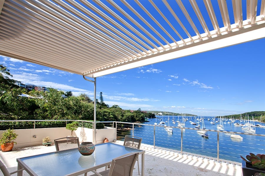 Amazing views of yachts from a Fairlight waterfront property, from under the opening roof awning.