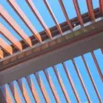 Riverview pergola with Eclipse Opening Roof and a DecoWood woodgrain finish.