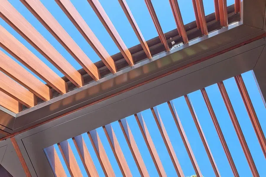 Riverview pergola with Eclipse Opening Roof and a DecoWood woodgrain finish.