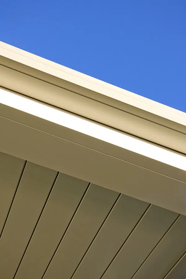 Close up of free standing louvre roof with white frame in Camden.
