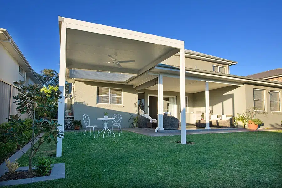 Free standing louvre roof with white frame in Camden.