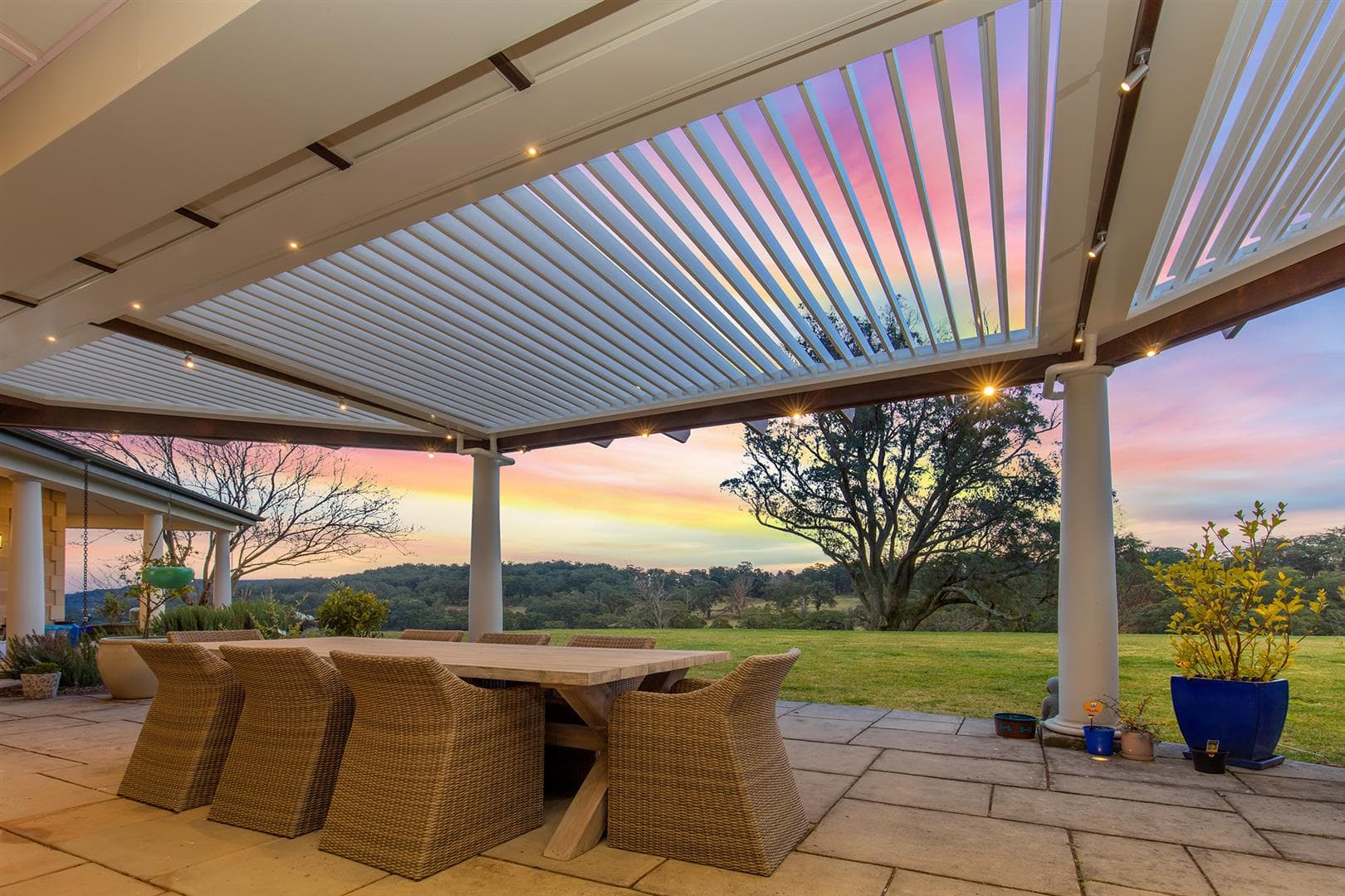 Pink and purple sky colours at dusk, coming through the Mittagong pergola opening roof.