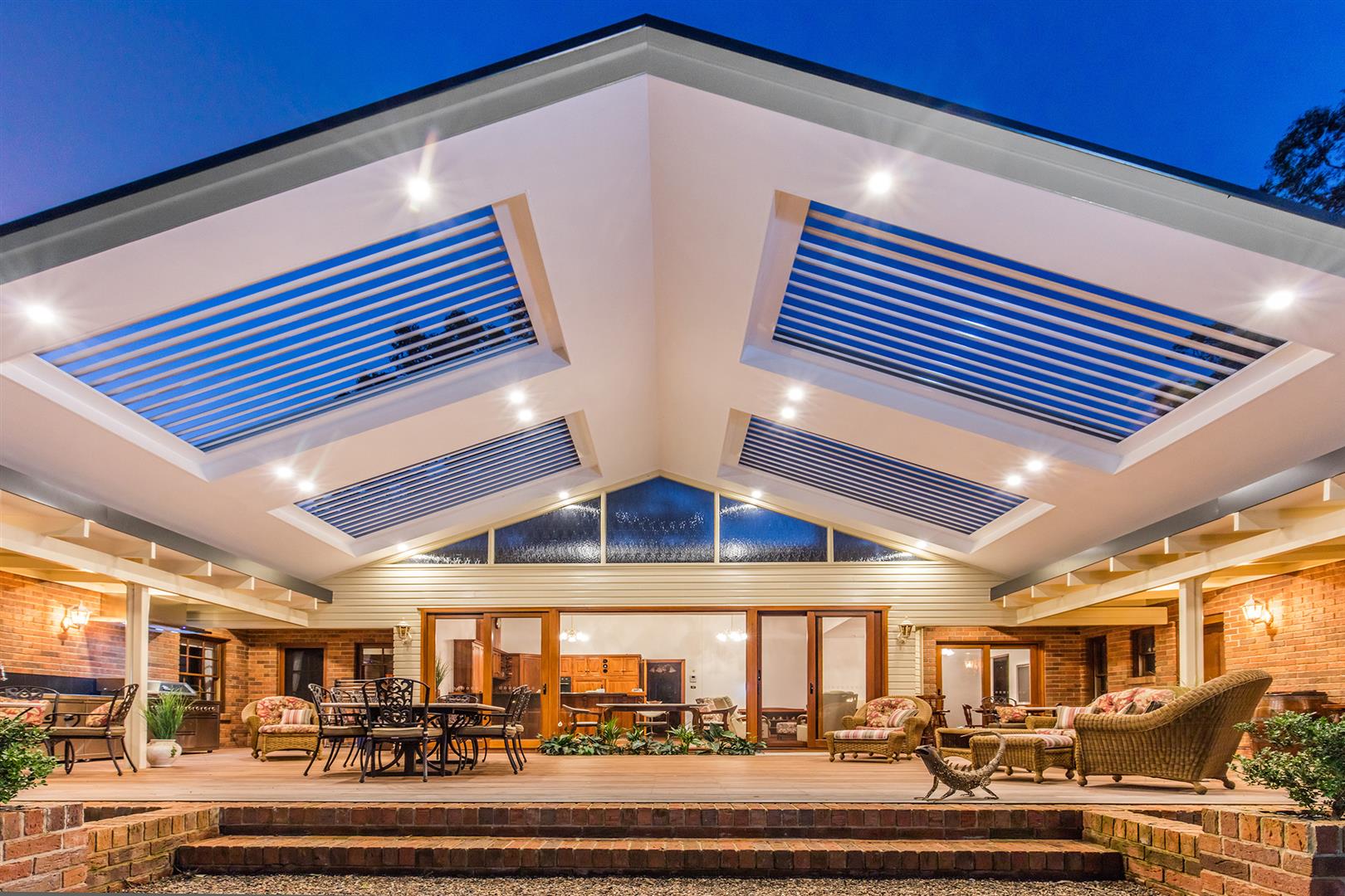 Amazing Windsor Downs pergola with gable roof design and custom integrated roof louvres.