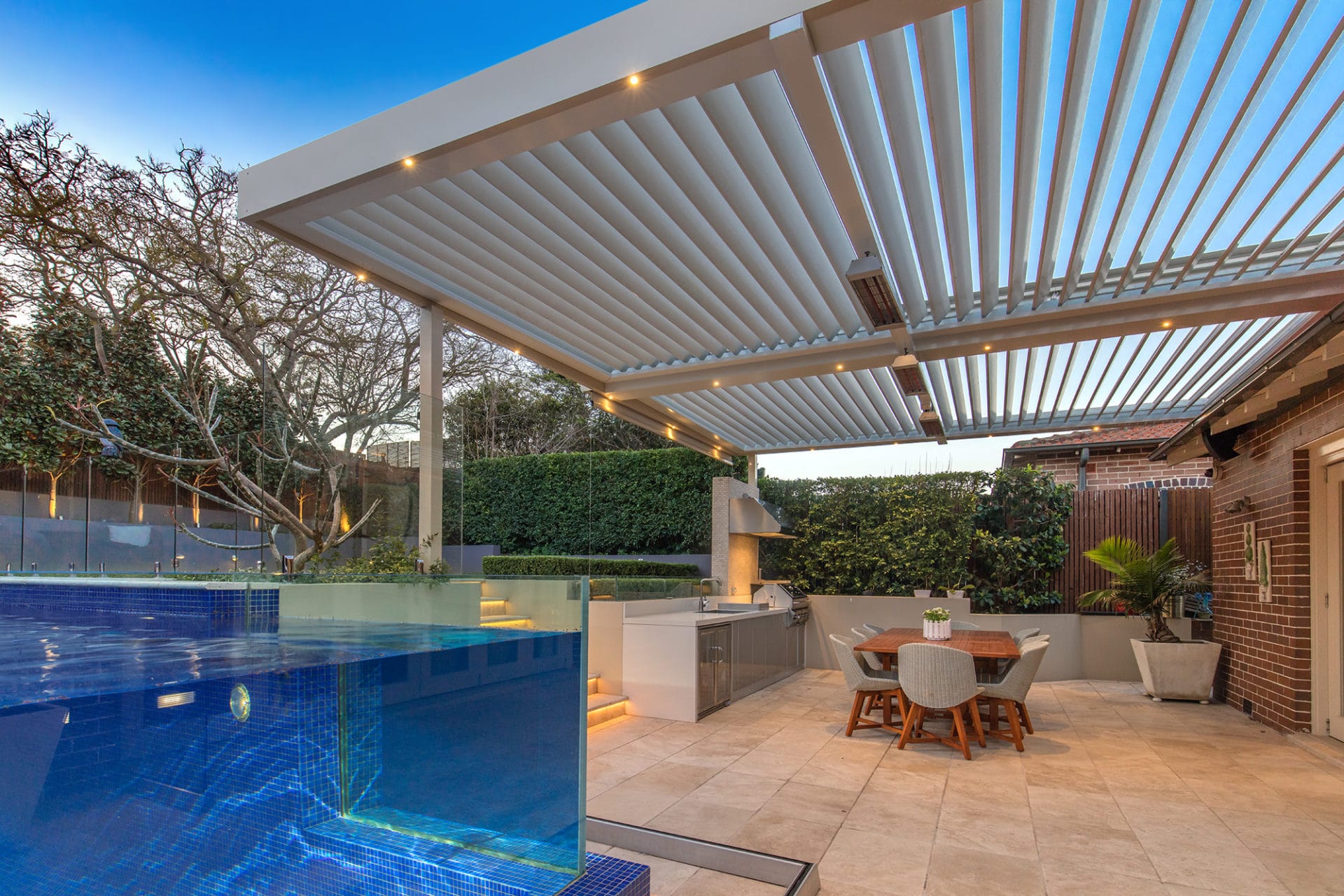 Haberfield backyard with luxury poolside pergola and fully equipped entertaining area.