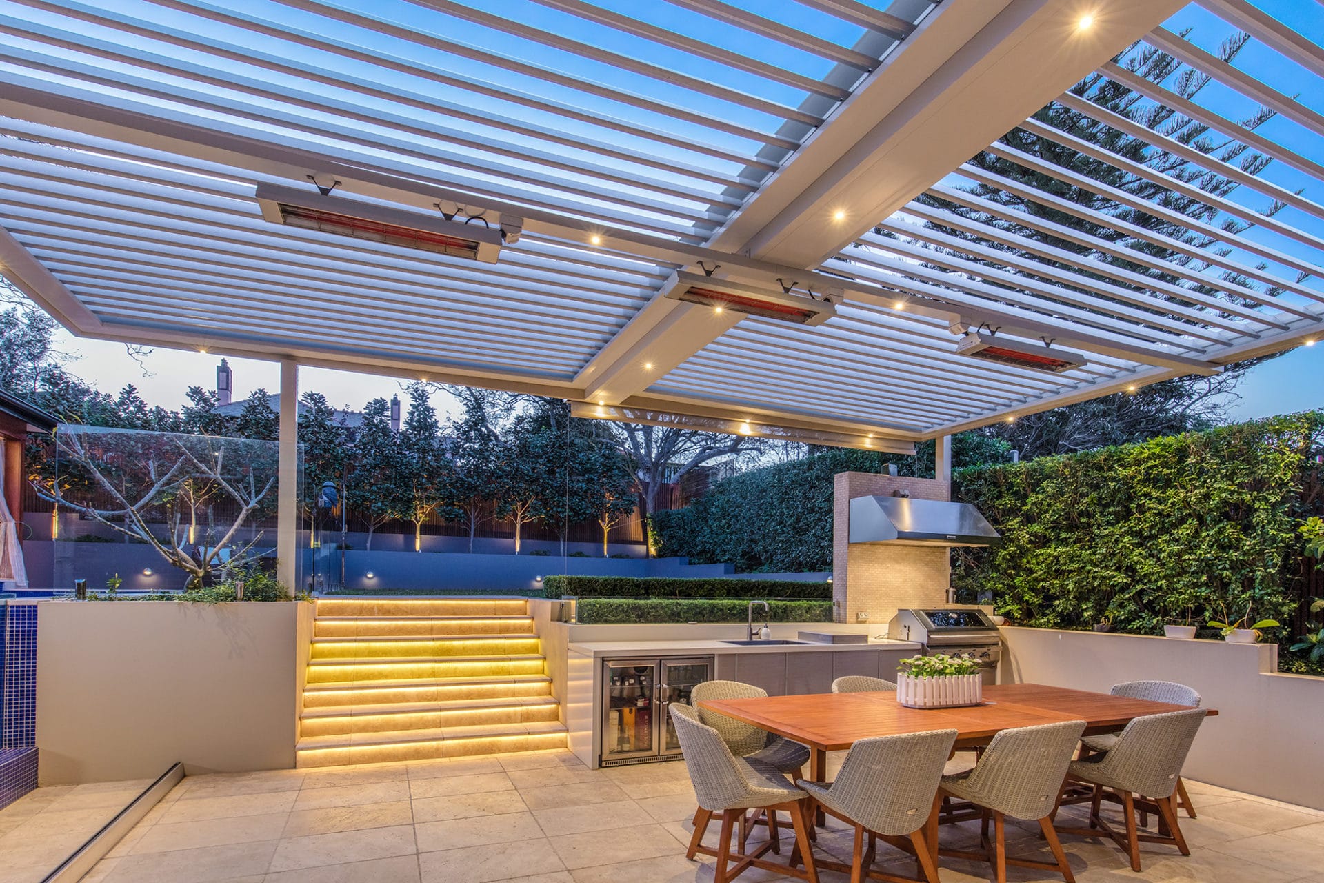 Haberfield pergola with custom features including LED lighting on the pool steps and integrated BBQ.