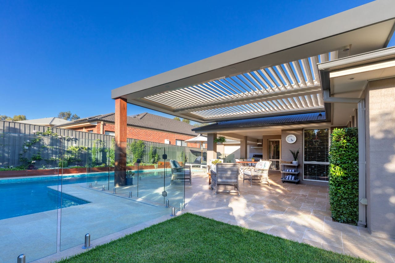 Kellyville Ridge pergola and poolside entertaining area with roof louvre system.