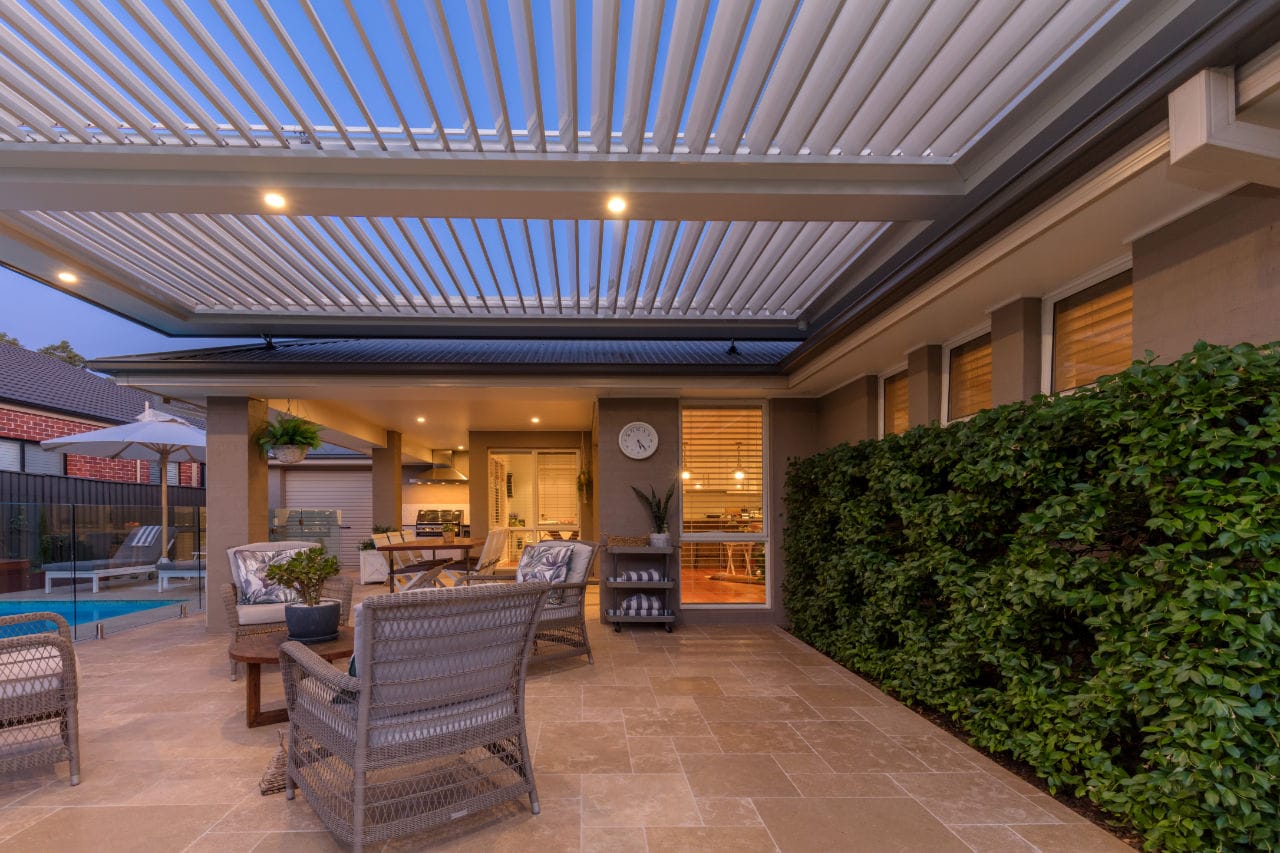 Kellyville Ridge pergola with LED downlights turned on at night time.