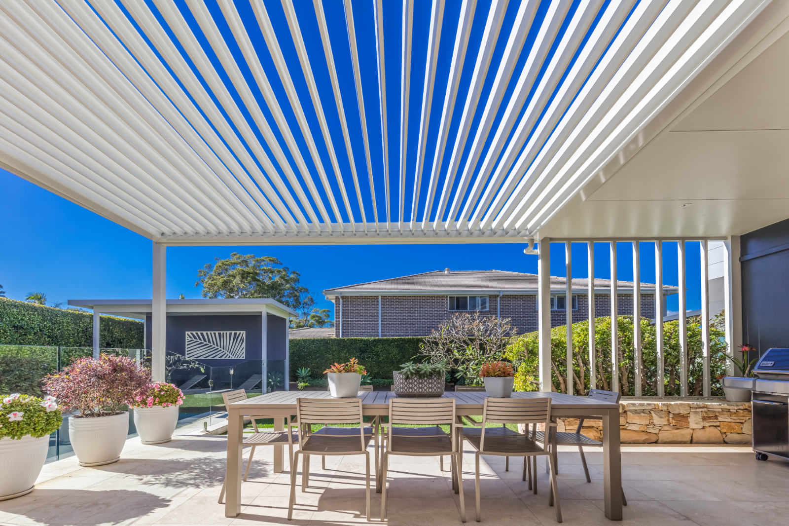 Side profile photos of Gymea Bay pergola, showing the opening roof louvres