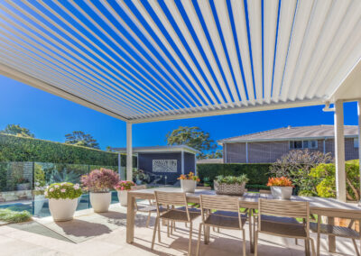 Pergola with a motorised opening roof system.