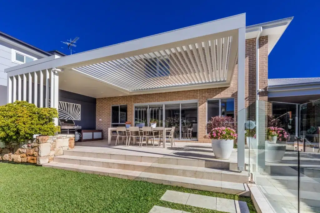 Tiled entertaining area at Gymea with an opening roof pergola