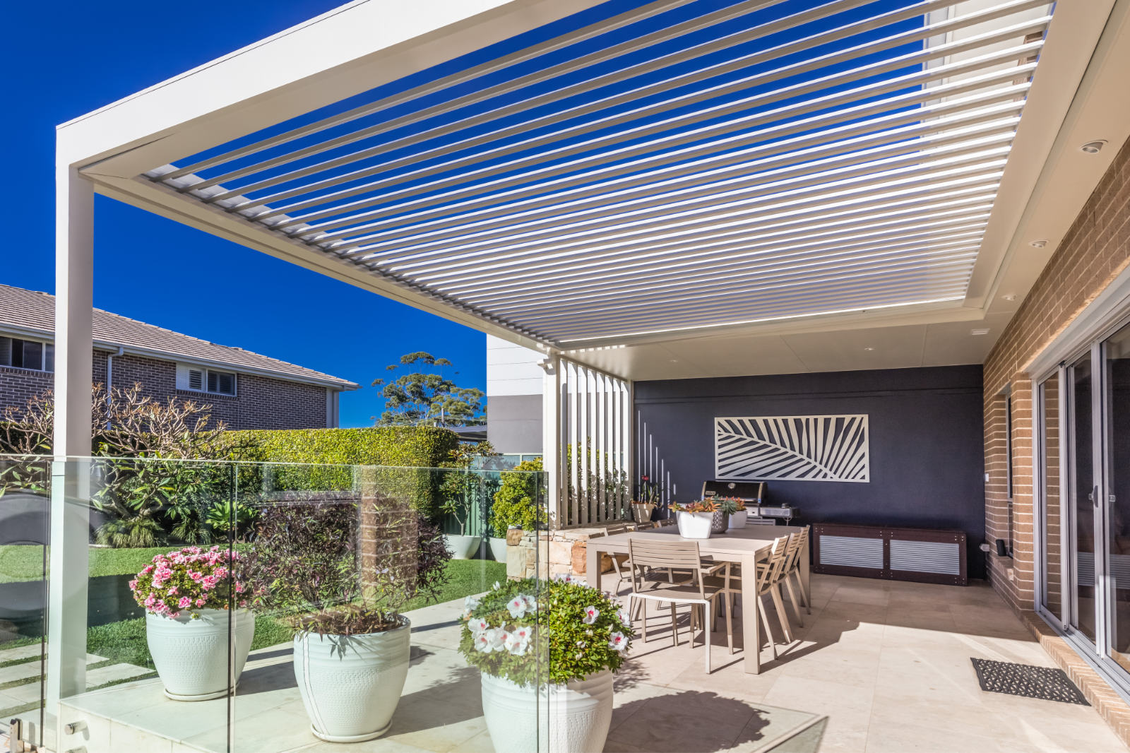 Tiled entertaining area at Gymea with an opening roof pergola
