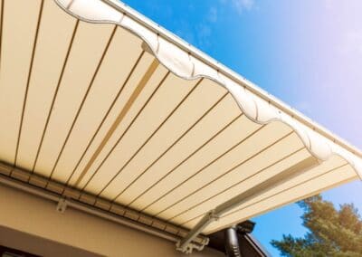 Creme coloured canvas awning.