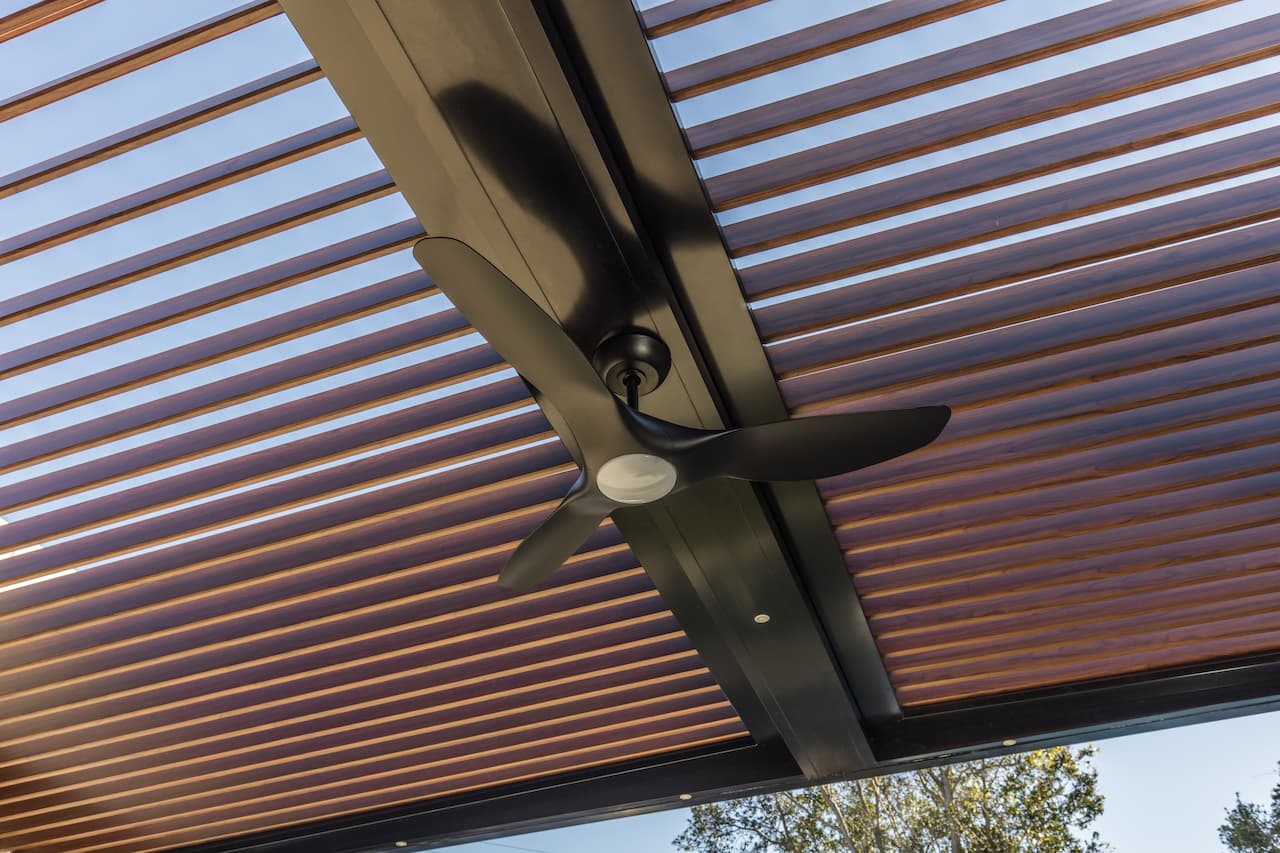 Outdoor ceiling fan on alfresco roof.