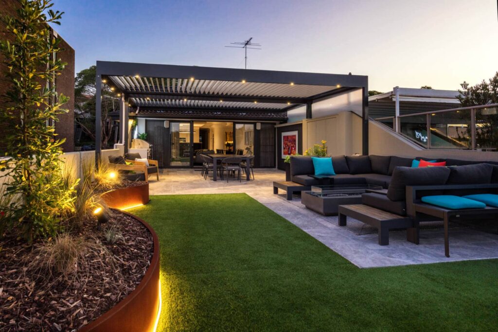 Abbotsford pergola in the backyard with LED strip lighting.