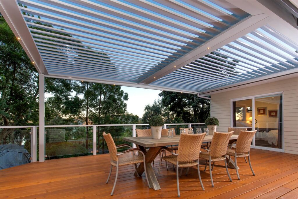 White Bayview pergola design with outdoor dining setting.