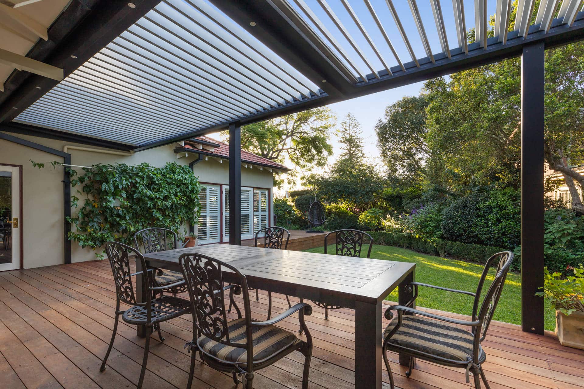 Dining table and chairs under the Chatswood pergola.