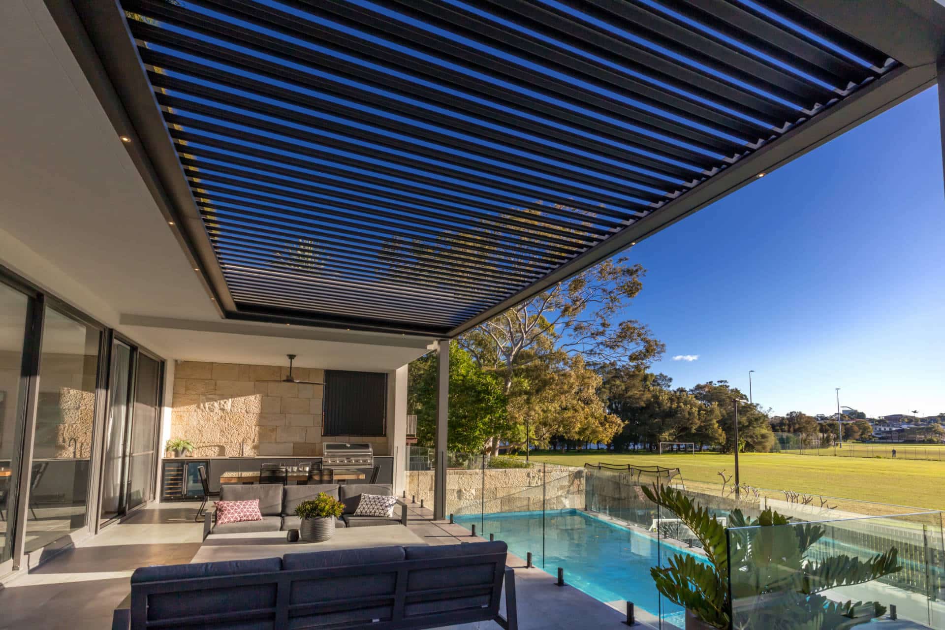 Tennyson Point pergola with grey roof louvres.
