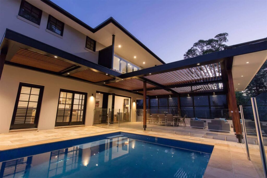 Turramurra pergola at night with open louvres.
