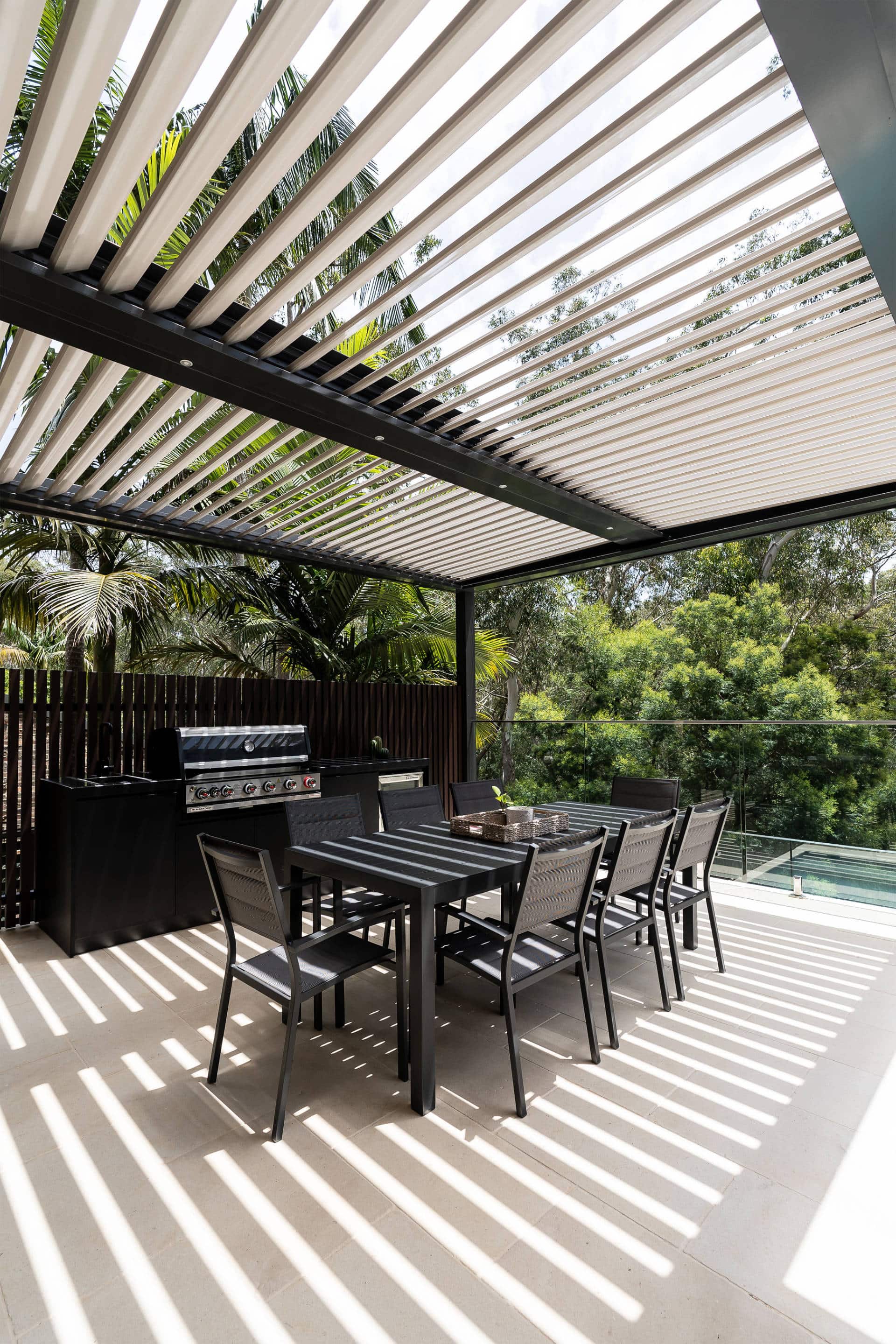 West Pymble pergola with BBQ and dining setting.