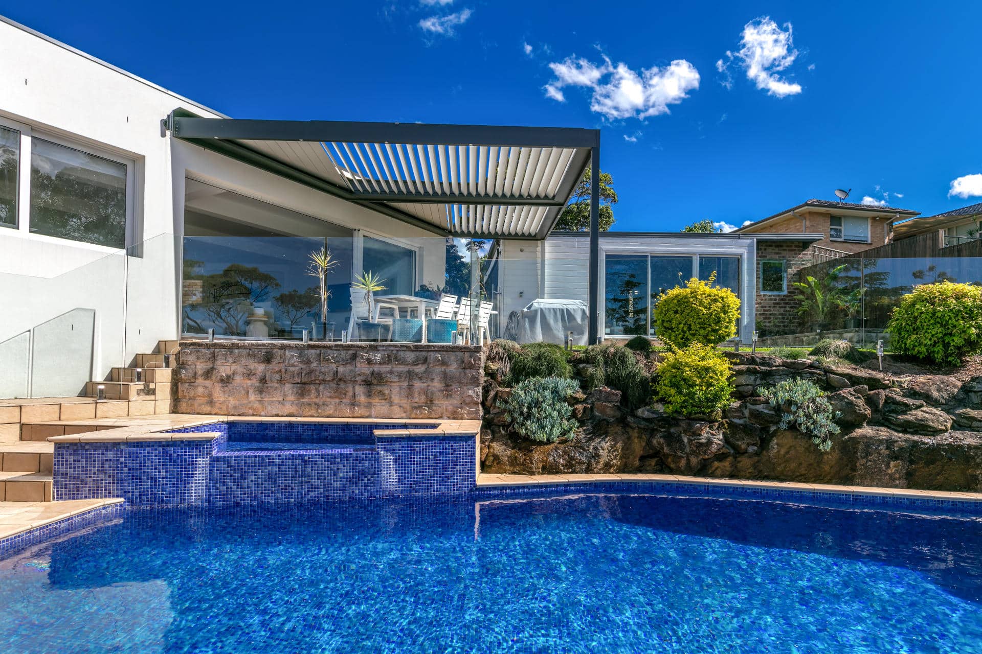 Opened louvres on Frenchs Forest pergola by the pool.