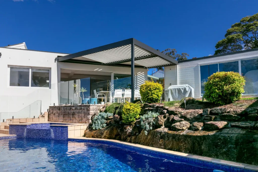 Opened louvres on Frenchs Forest pergola by the pool.