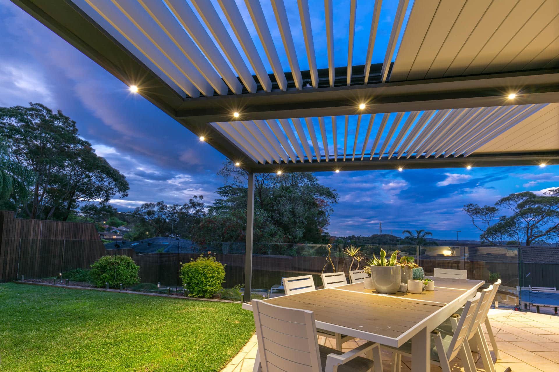 Opened louvres on Frenchs Forest pergola at dusk.