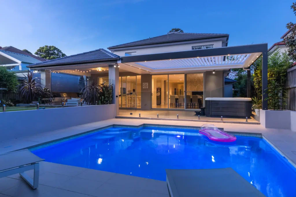 Opened louvres on Lane Cove pergola by the pool.