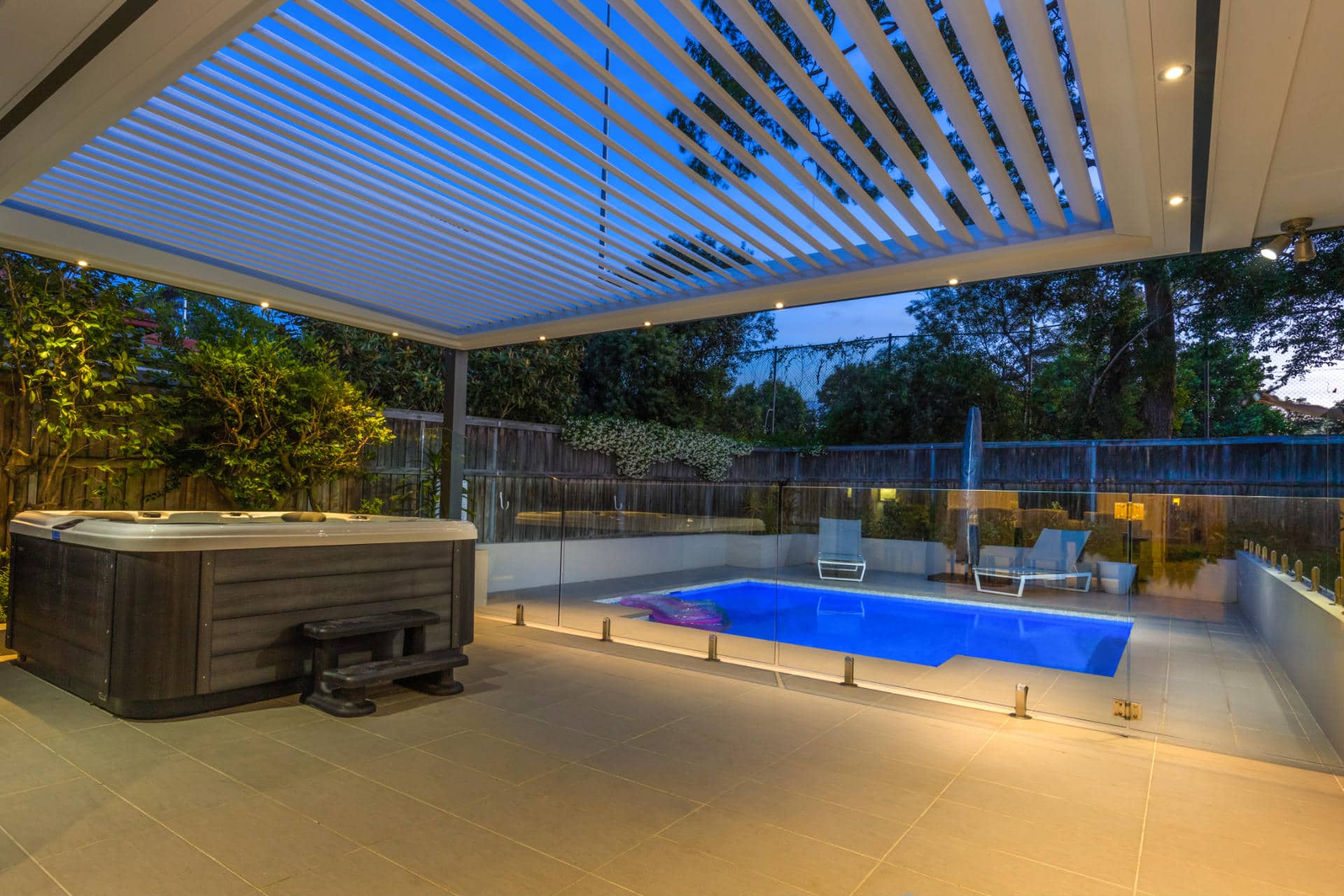 Opened louvres on Lane Cove pergola by the pool.