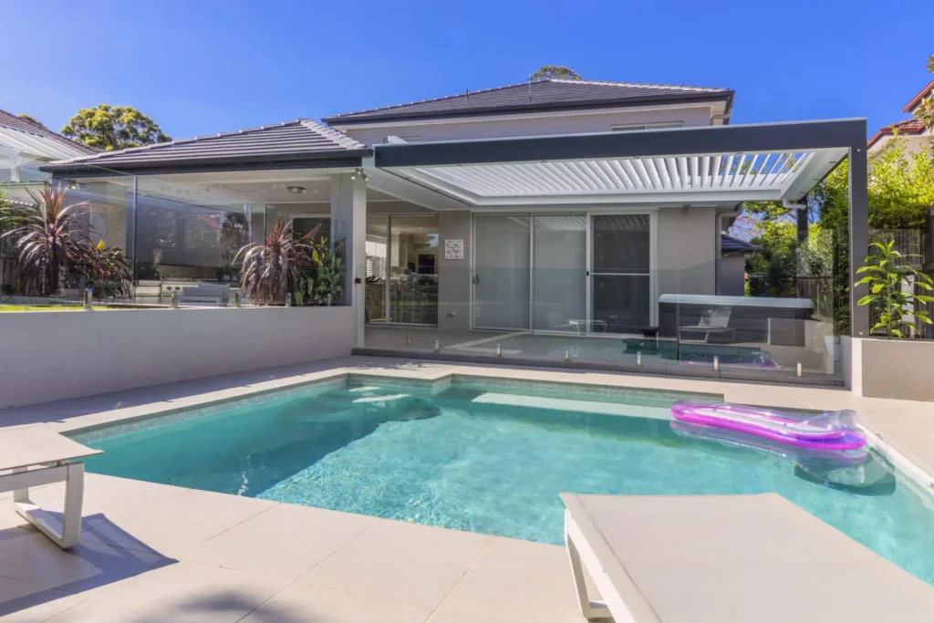 Opened louvres on Lane Cove pergola by the pool.