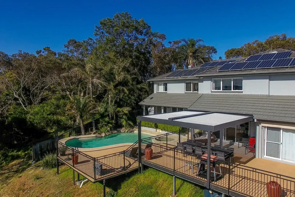 Aerial photo of a Beacon Hill home with a new opening roof pergola by poolside