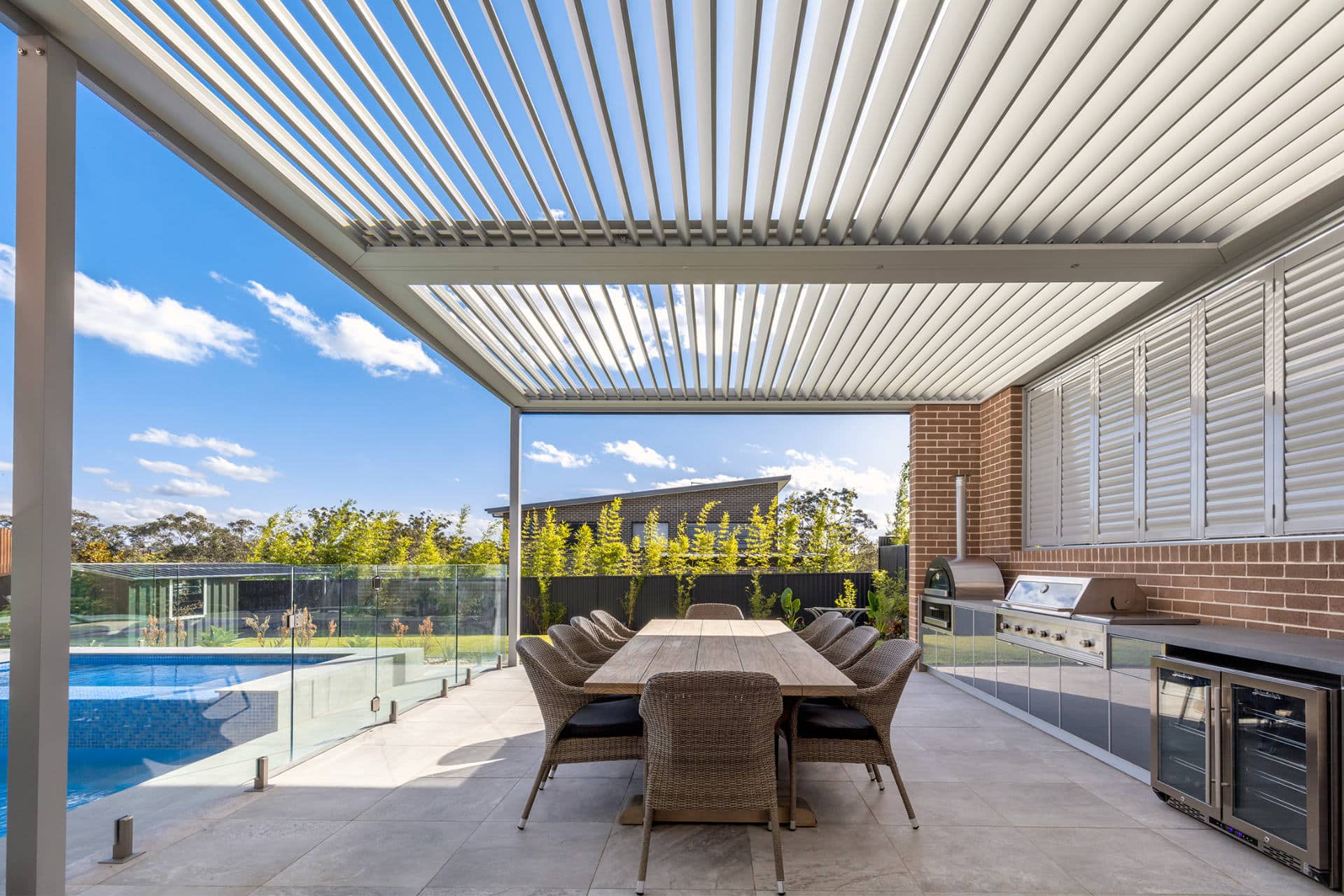 An up close photo of opened louvres on a new opening roof pergola at a North Kellyville home.