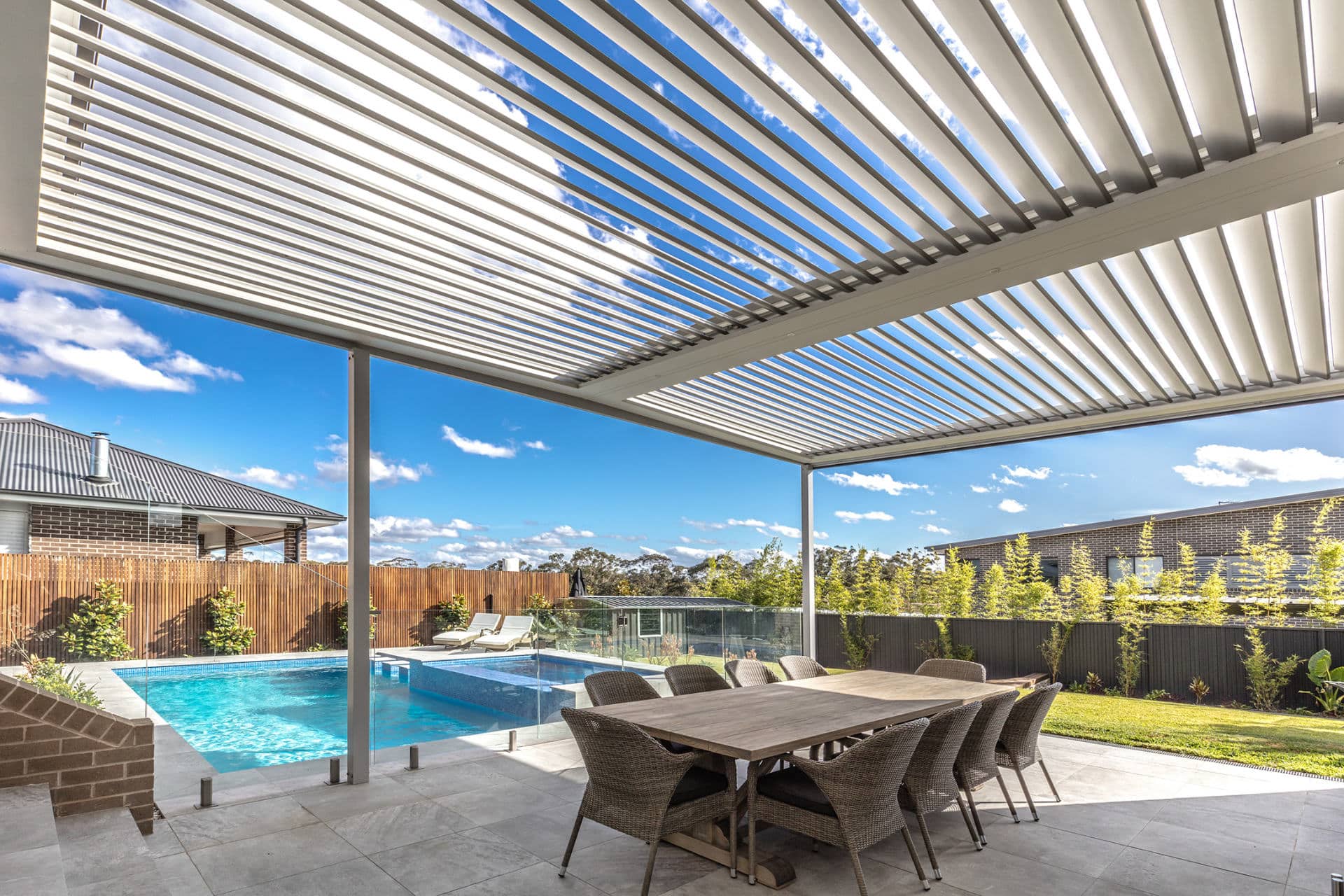 An up close photo of opened louvres on a newly installed opening roof pergola of a North Kellyville home