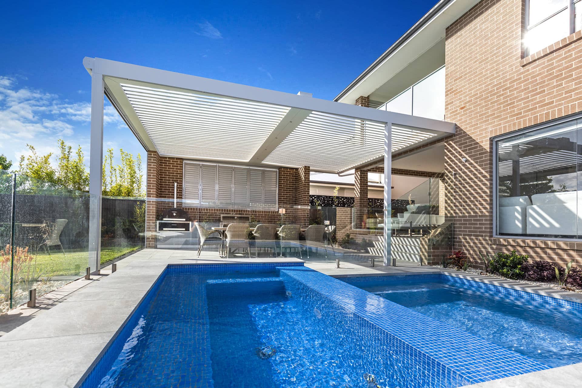 A North Kellyville home with new opening roof pergola alongside pool area