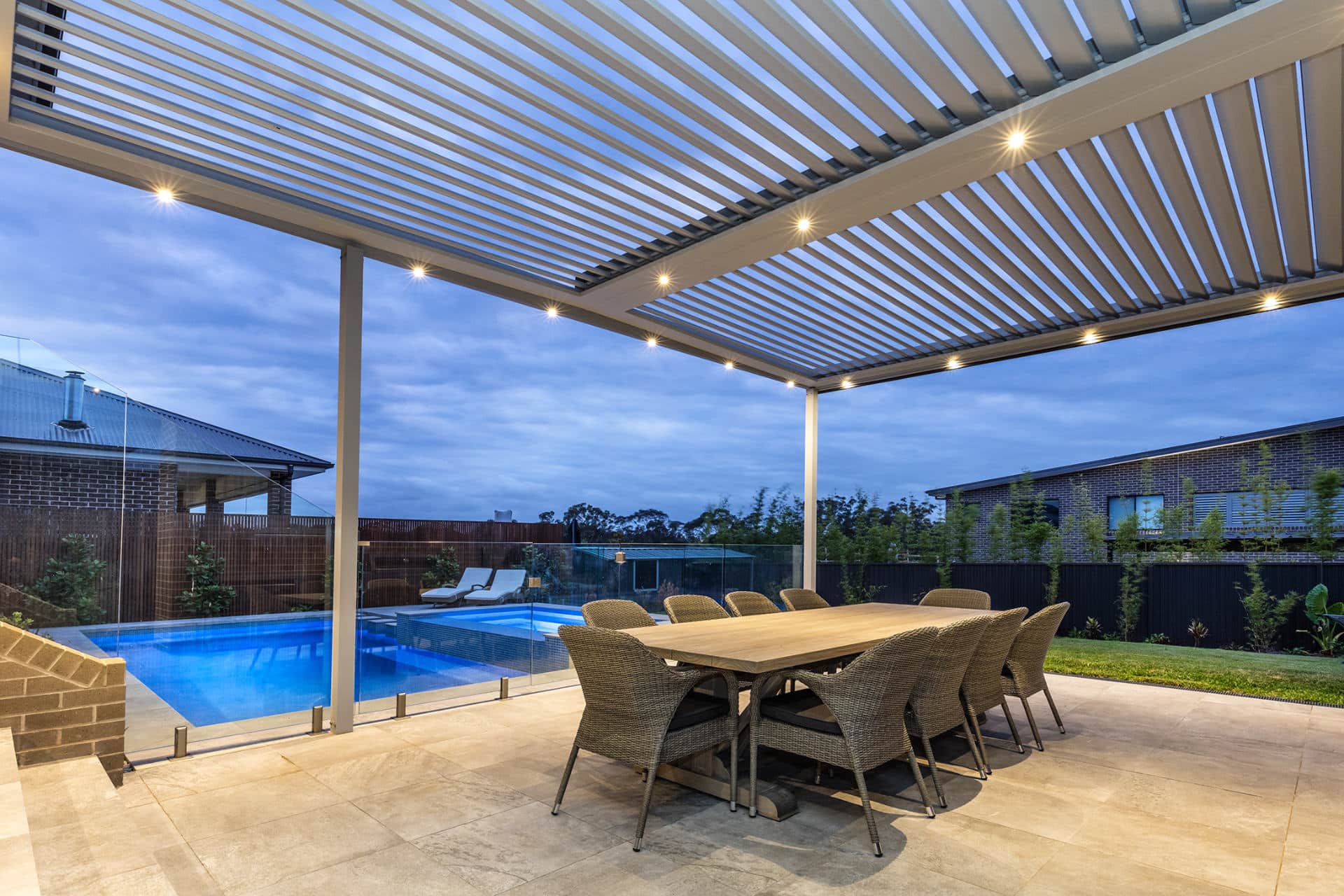 A new opening roof pergola alongside pool area showcasing the sophisticated integrated LED lighting
