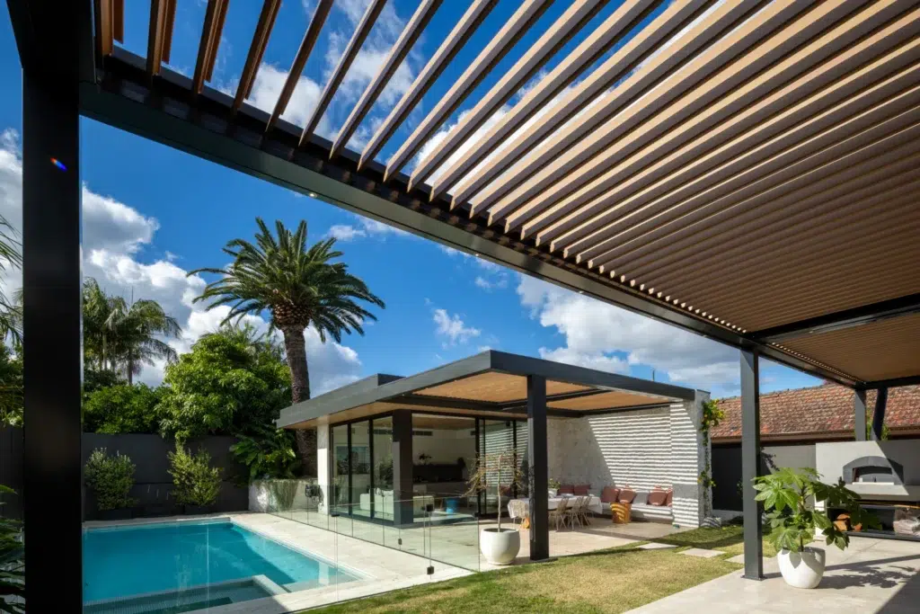 View of the poolside area from underneath the Concord opening roof system.